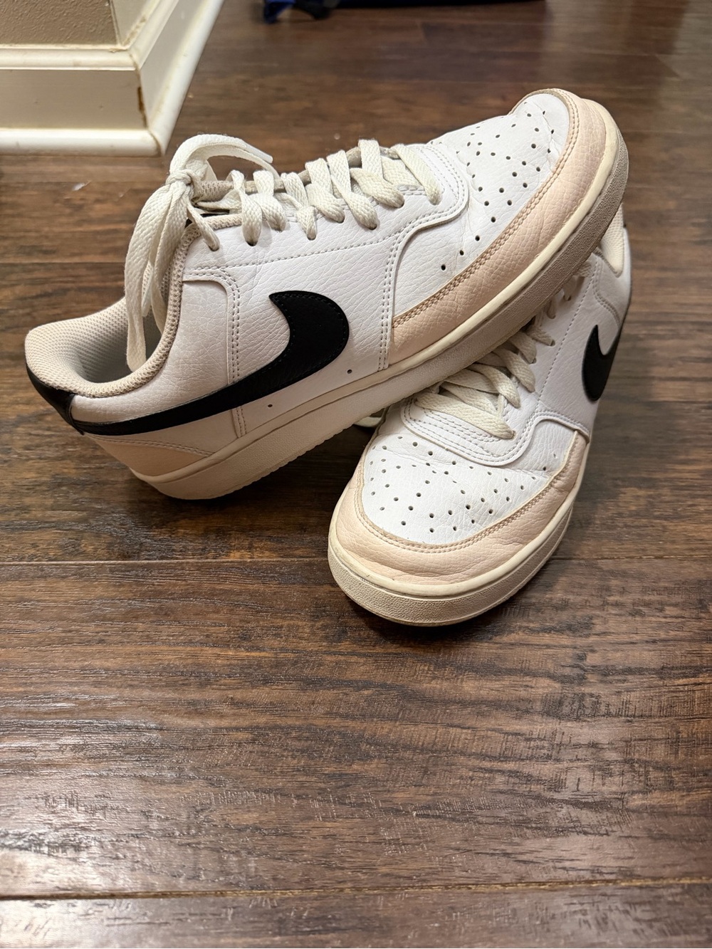 Nike White Sneakers with Black Swoosh and Cream Accents